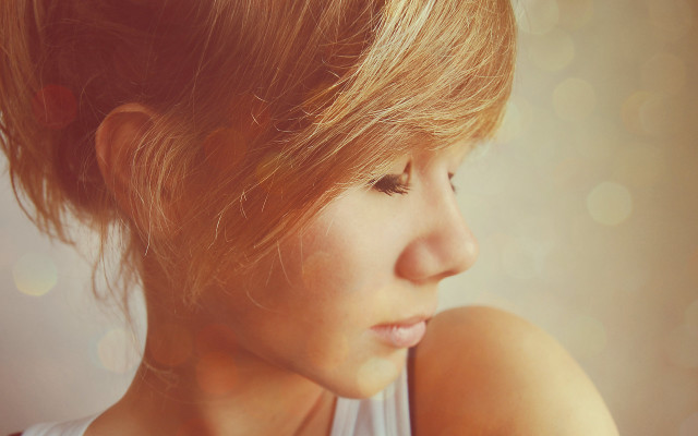 Woman messybun lookingdown closeup realistic #2 free wallpaper - medium preview image