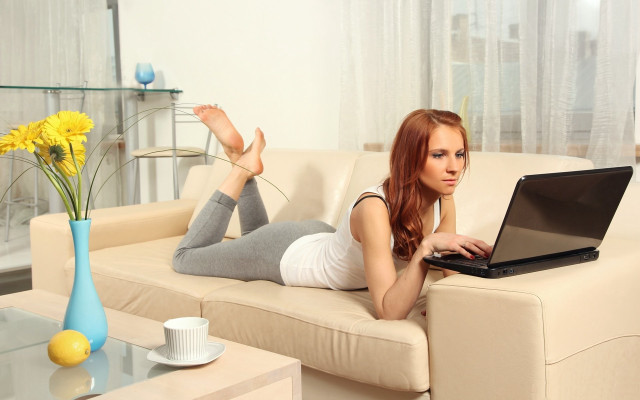 Woman laying couch laptop flowers free wallpaper - medium preview image