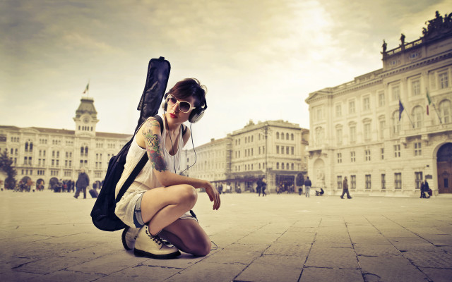 Woman kneeling guitar case backpack #2 free wallpaper - medium preview image
