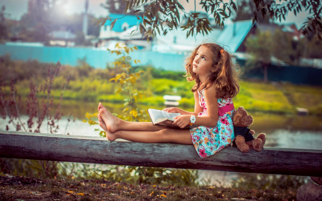 Little girl reading autumn river free wallpaper - medium preview image