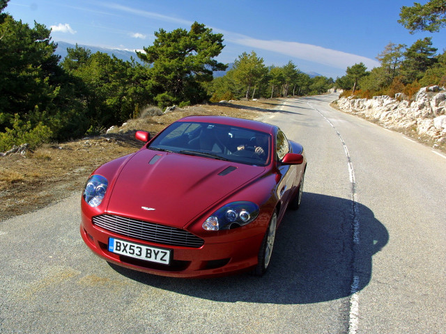 Red car forest hill mountain free wallpaper - medium preview image