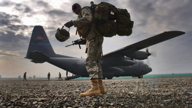 Soldier military plane rocky ground free wallpaper - medium preview image