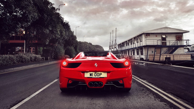 Red sports car cityscape cloudy free wallpaper - medium preview image
