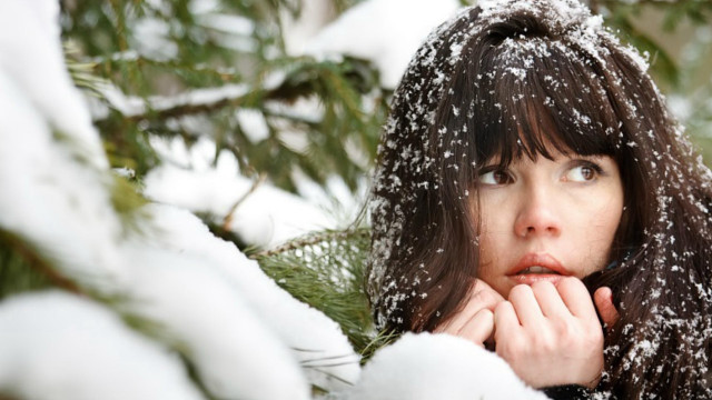 Woman snowy background looking up free wallpaper - medium preview image