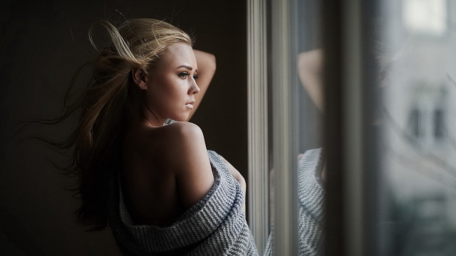 Woman leaning window blonde blurry free wallpaper - medium preview image