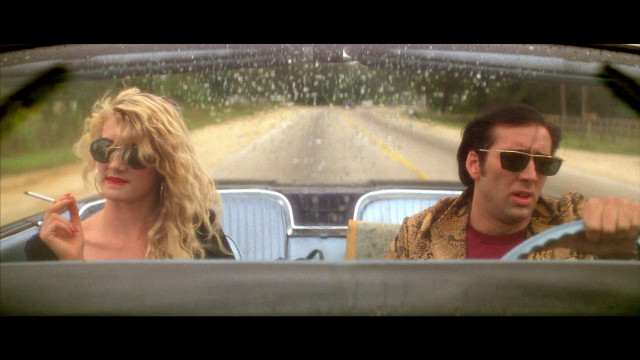 Man woman driving car rain #2 free wallpaper - medium preview image