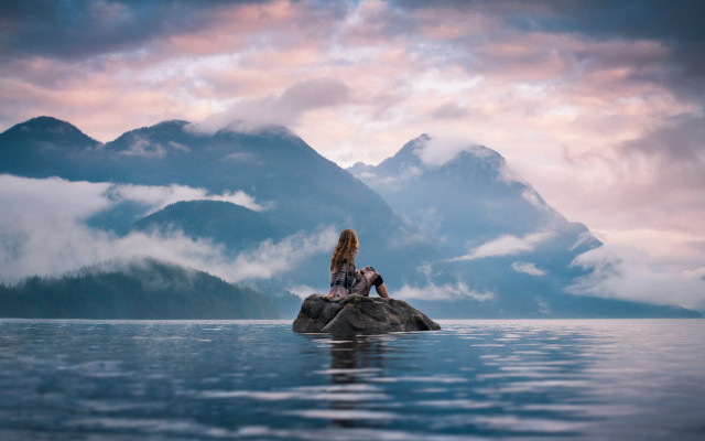 Woman lake rock mountains clouds free wallpaper - medium preview image