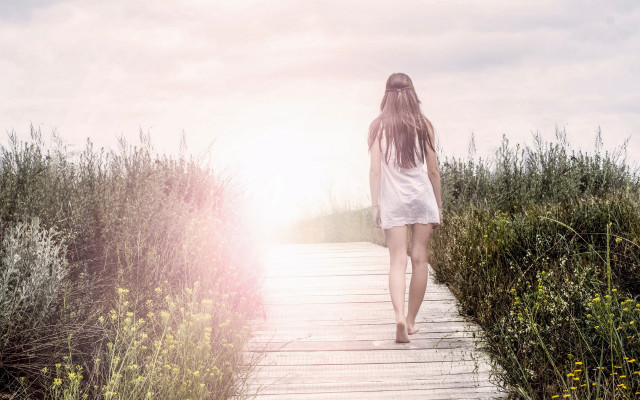 Woman walking flower field sunset free wallpaper - medium preview image