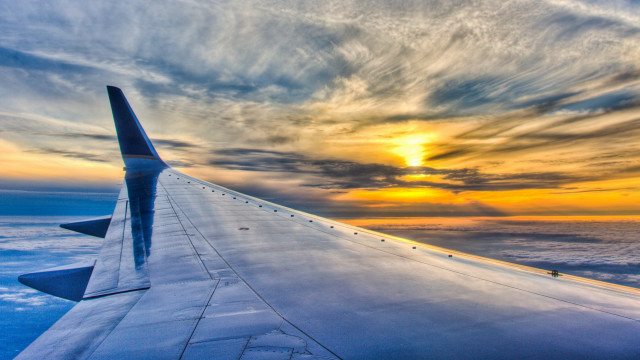 Plane wing sunset ocean clouds free wallpaper - medium preview image