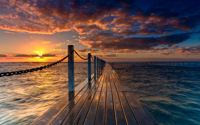 Sunset dock water clouds cityscape free wallpaper - medium preview image