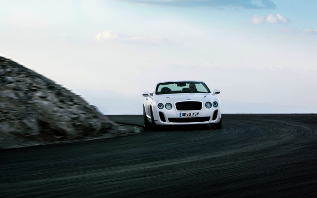 White car desert rocks motion free wallpaper - medium preview image