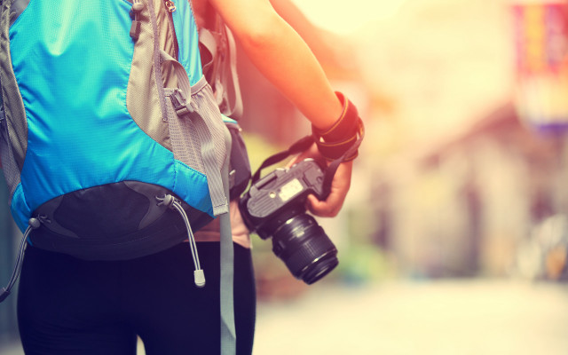 Camera backpack street buildings blurry free wallpaper - medium preview image