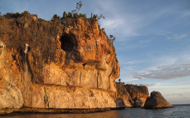 Cliff cave boat autumn sky free wallpaper - medium preview image