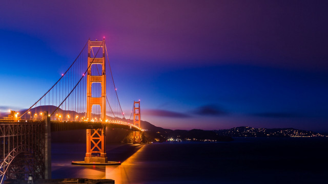 Lit bridge night water mountain free wallpaper - medium preview image