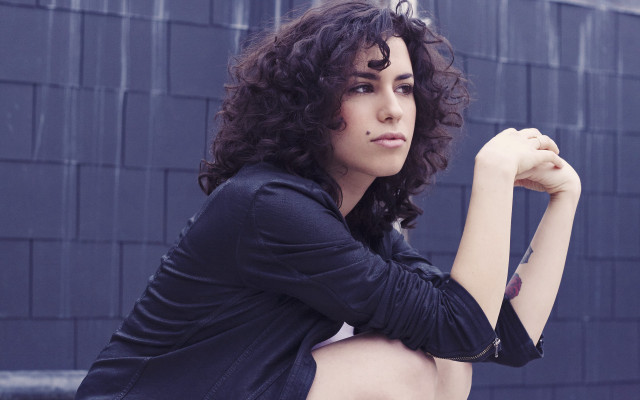 Woman curly hair rooftop fence free wallpaper - medium preview image