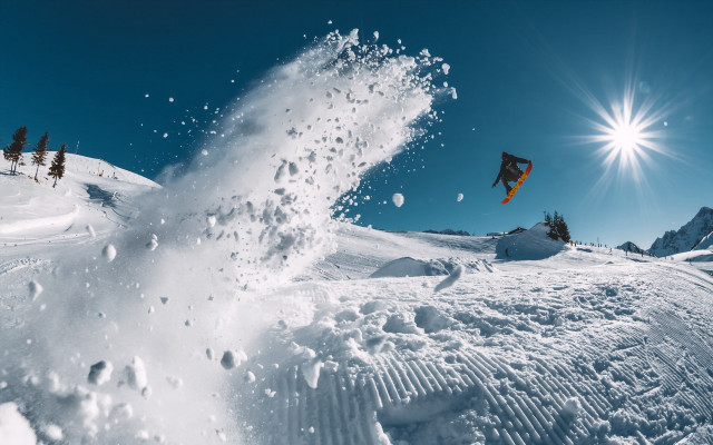 Snowboard jump sunny sky starry free wallpaper - medium preview image