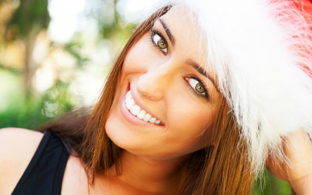 Woman santa hat smiling wind free wallpaper - medium preview image