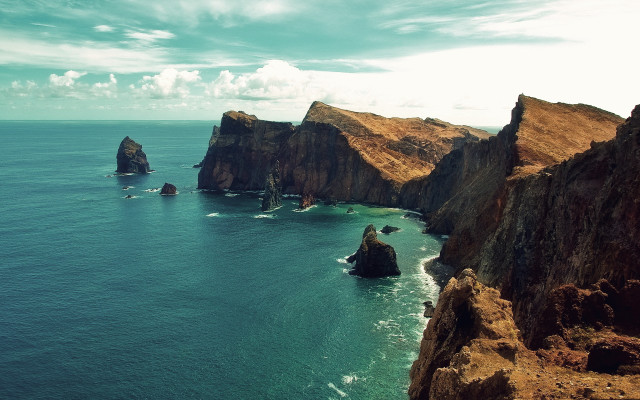 Rocky cliff water clouds beach free wallpaper - medium preview image