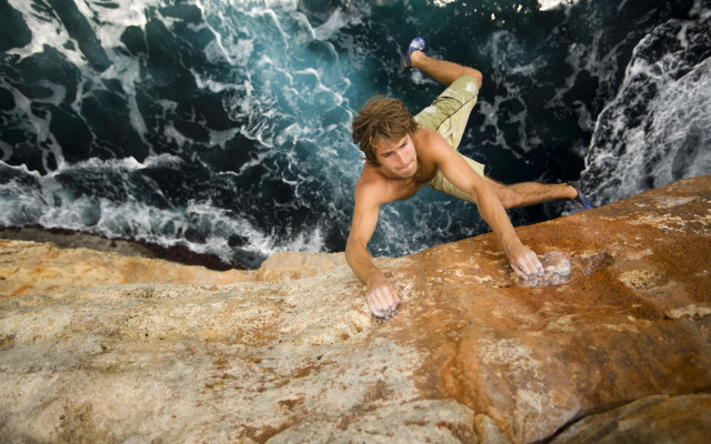 Cliff climber surfboard bottle beach free wallpaper - medium preview image