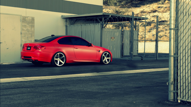 Red car building street fence free wallpaper - medium preview image