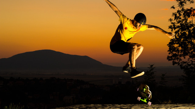 Man jumping skateboard watching autumn free wallpaper - medium preview image