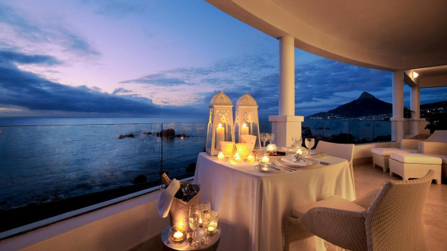 Balcony ocean night candles plates free wallpaper - medium preview image
