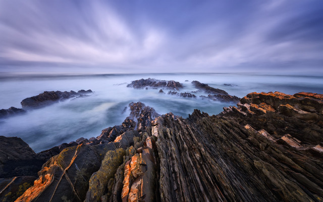 Rocky beach longexposure clouds shoreline free wallpaper - medium preview image
