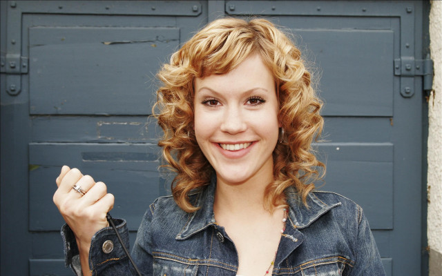 Curly hair denim jacket smiling free wallpaper - medium preview image