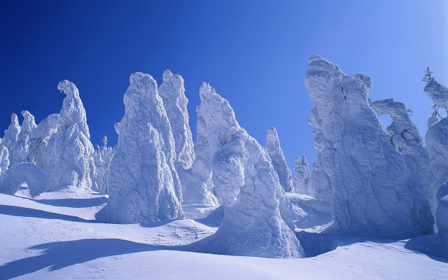 Skier snowy mountains blue sky free wallpaper - medium preview image