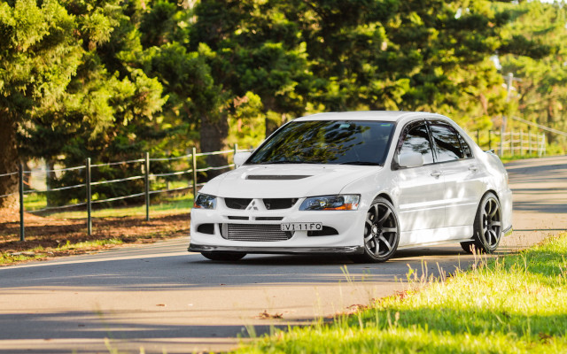 White car forest road sunny free wallpaper - medium preview image