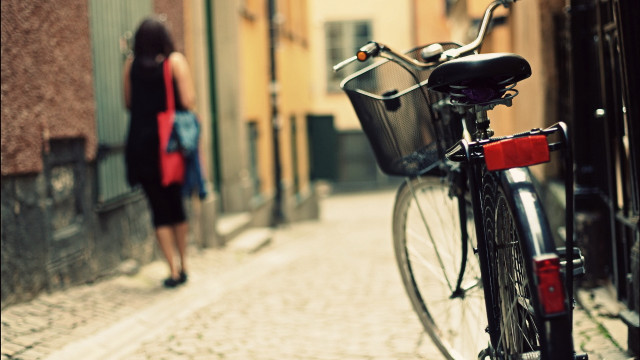 Bicycle street woman redpurse tiltshift free wallpaper - medium preview image