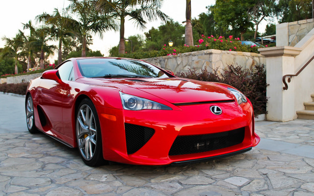 Red sports car cobblestone driveway free wallpaper - medium preview image