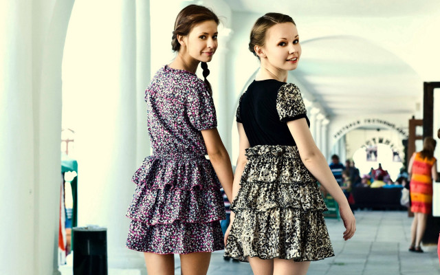 Two women hallway smiling dresses free wallpaper - medium preview image