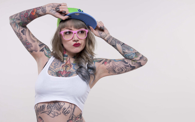 Tattooed woman hat glasses bodyart free wallpaper - medium preview image