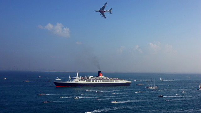 Ocean ship plane beach sky free wallpaper - medium preview image