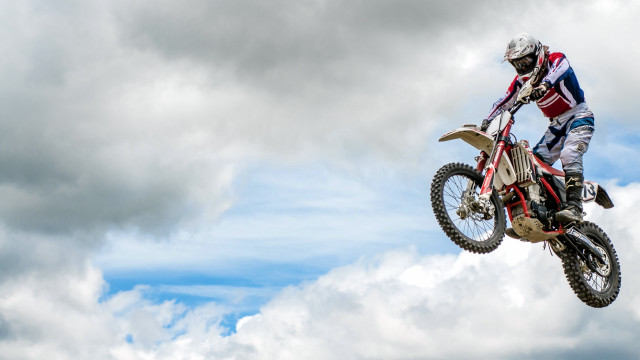 Dirt bike trick cloudy sky free wallpaper - medium preview image
