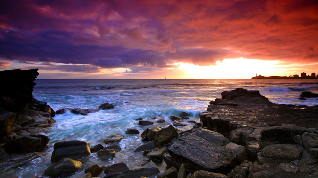 Sunset ocean rocks water sailboat #2 free wallpaper - medium preview image