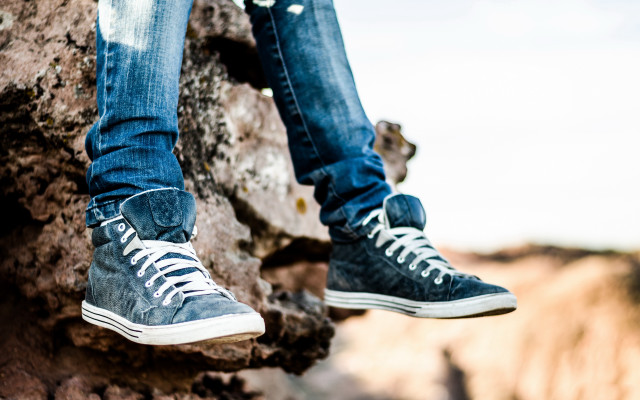 Person rock shoes outdoors blurry free wallpaper - medium preview image
