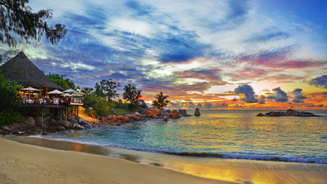 Beach hut sunset clouds boat free wallpaper - medium preview image