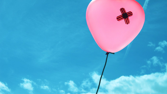 Pink balloon cross floating blue free wallpaper - medium preview image