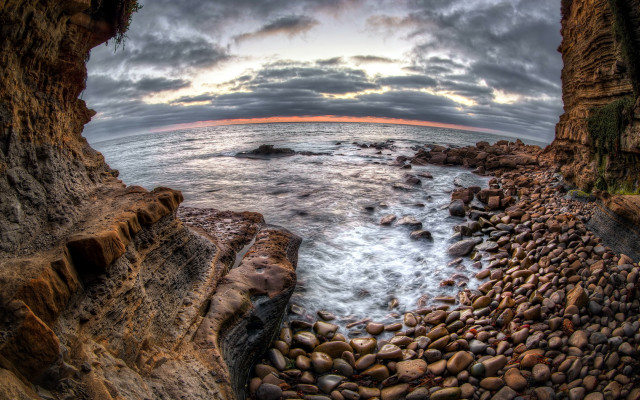 Rocky beach sunset horizon ocean free wallpaper - medium preview image