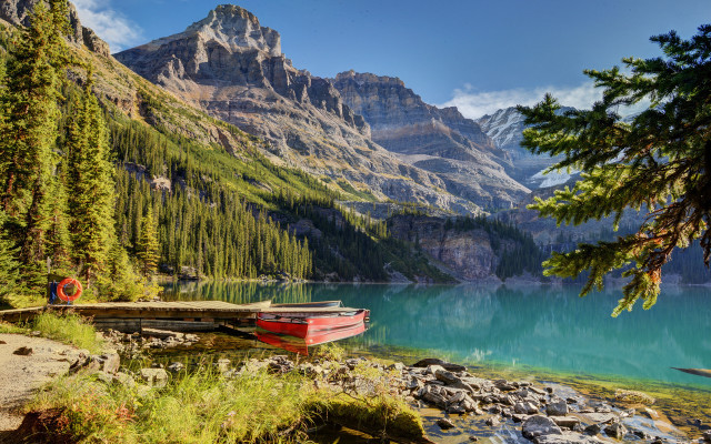 Rocky shore mountain lake boat free wallpaper - medium preview image
