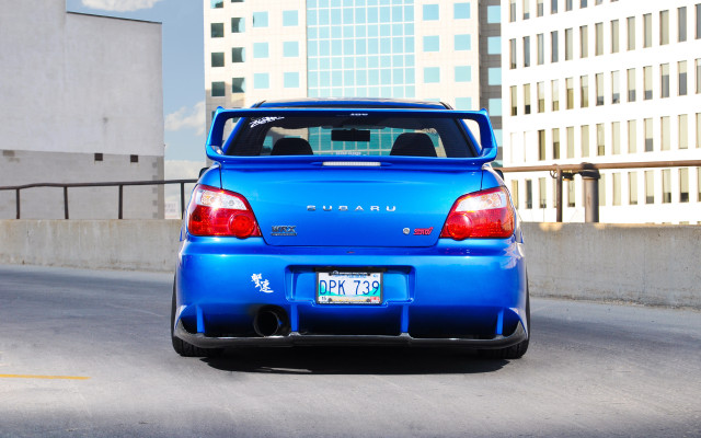 Blue car city street fence free wallpaper - medium preview image