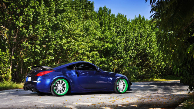 Blue sports car parked rim free wallpaper - medium preview image
