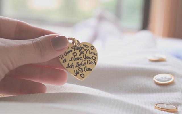 Heart keychain coins tattoo blurry free wallpaper - medium preview image