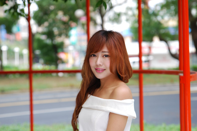 Red haired woman park bokeh free wallpaper - medium preview image