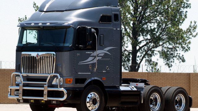 Semi truck parking lot tree free wallpaper - medium preview image