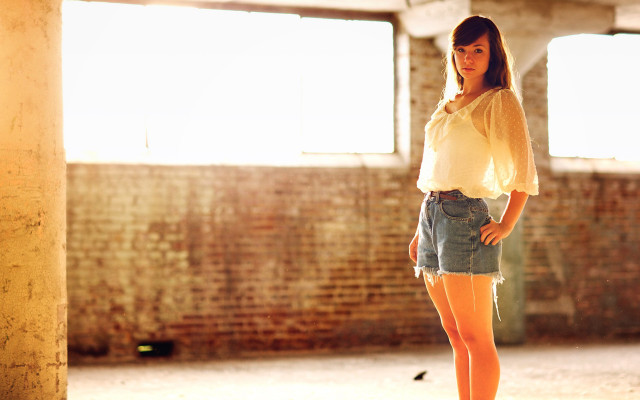 Woman skateboard brick wall sunset free wallpaper - medium preview image