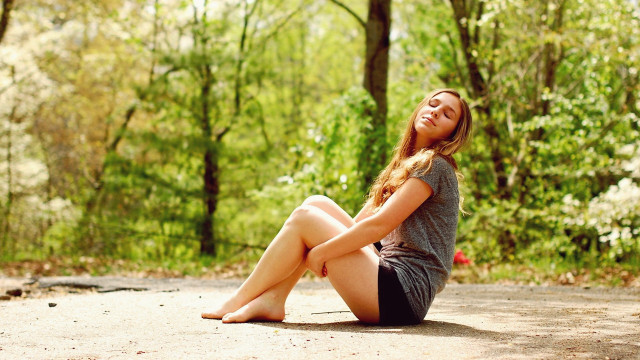 Woman sitting woods smiling barefoot free wallpaper - medium preview image