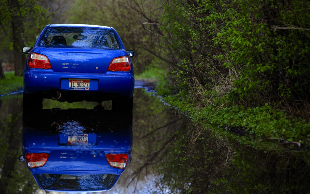 Blue car parked reflections forest free wallpaper - medium preview image